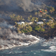 Image for article titled New aerial photos show Kilauea’s lava devouring neighborhoods